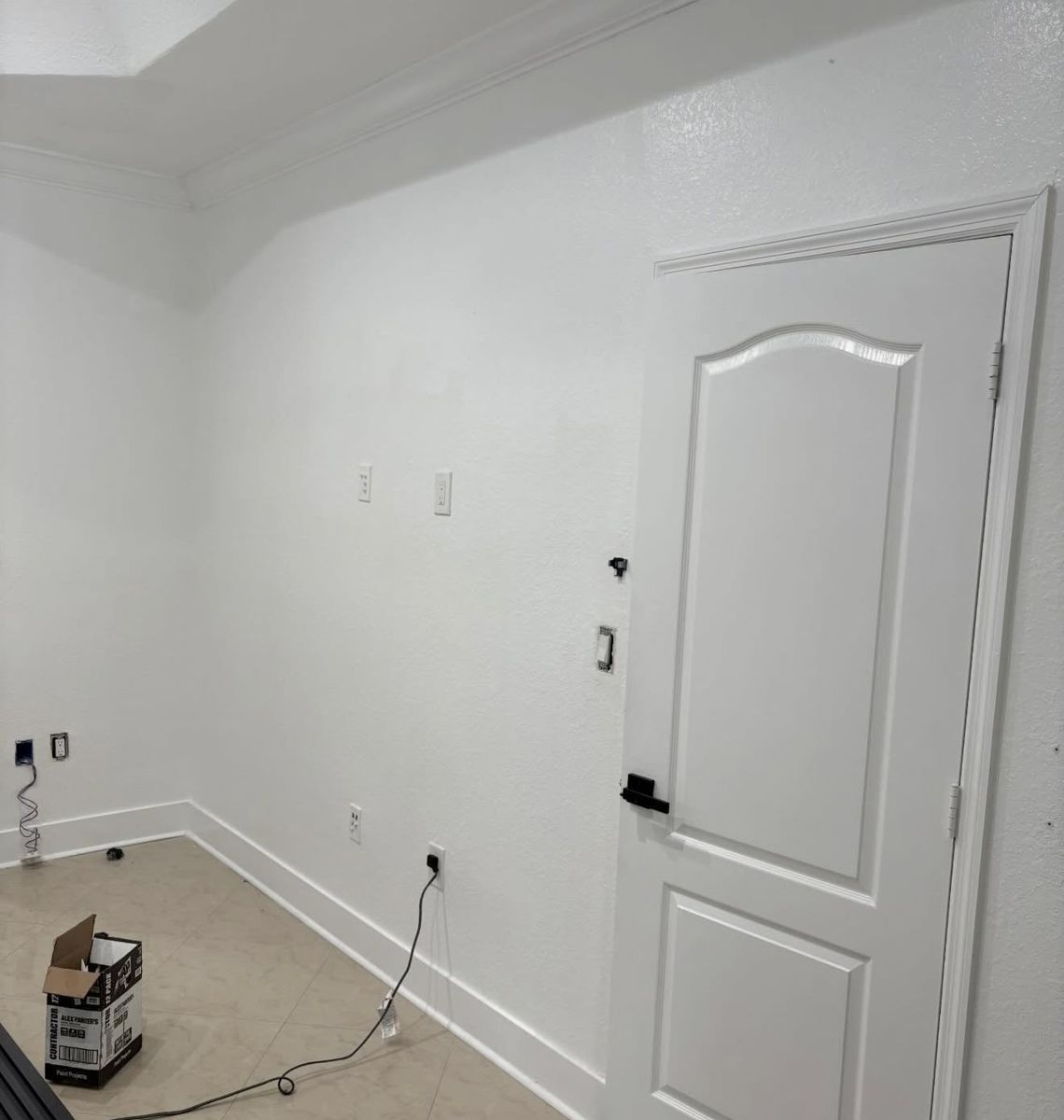 The same bedroom before the slat wall and TV went up